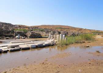 Fototapeta na wymiar Ruins of a white temple in Delos island, Cyclades archipelago, Greece.
