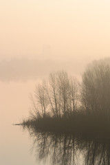 The island in the fog at dawn