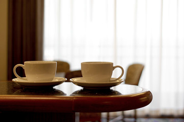 Fototapeta premium cup of coffee on wooden table