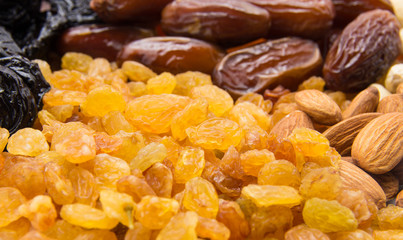 Mix nuts dry fruits and chocolate on a white background