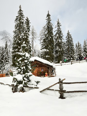 Alpine hut in winter in the Alps. Winter Landscape in a Forest near Lake Antholz Anterselva, South Tirol, Italy