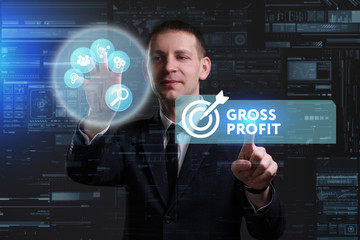 Business, Technology, Internet and network concept. Young businessman working on a virtual screen of the future and sees the inscription: Gross profit
