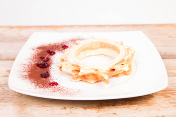 Polish-Lithuanian traditional spit cake ('tree cake') -sekacz (polish) or sakotis (lithuanian) on a wooden background