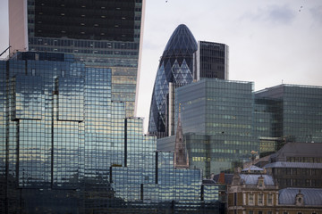 Perspective and underside angle view to textured background of modern glass building skyscrapers
