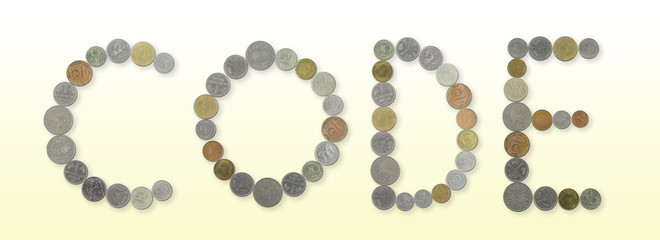 CODE – Coins on yellow background