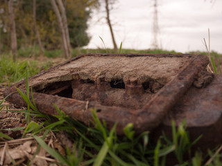 Broken Old Equipment on the Floor From Old Age and War, Light Box Unused and Dirty with Rust and Grit
