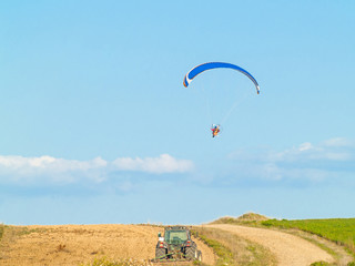 A man practicing extreme sport with paraglider with motor