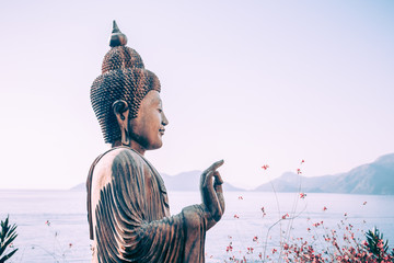 Buddha statue outdoors near the sea