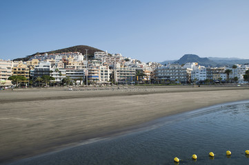View of the resort promenade with shops, bars and restaurants and the popular beach, Playa de los Cristianos