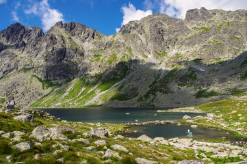 Great mountain peaks above the lake in the High Tatras. Slovakia.