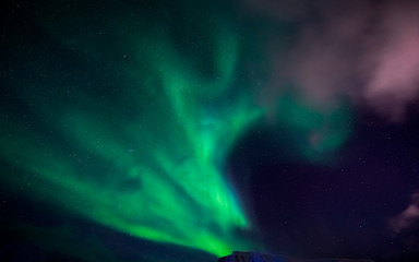 The polar Northern lights in the mountains of Svalbard, Longyearbyen, Spitsbergen, Norway wallpaper