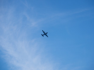 plane on blue sky and clouds