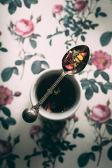Teaspoon of Herbal Loose Tea resting on Tea Cup