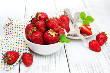 ripe strawberries on wooden table