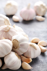 Garlic on the grey wooden table