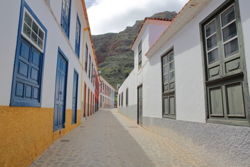 AGULO, LA GOMERA, SPAIN: Cobbled street with colorful houses inside the village of Agulo