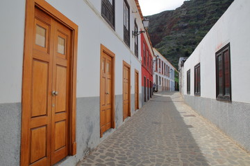 AGULO, LA GOMERA, SPAIN: Cobbled street with colorful houses inside the village of Agulo