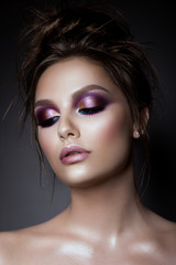 Beautiful woman with professional make up and hairstyle