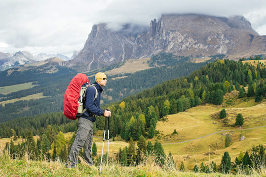 Trekker in Dolomite mountains, Italy