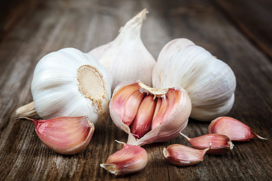 Fresh garlic on a wooden background
