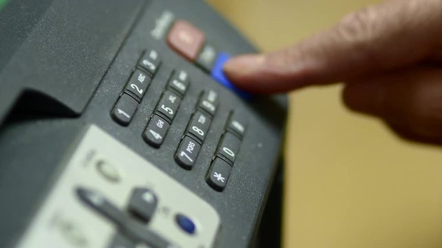 Elderly Man Dials The Numbers On MFP