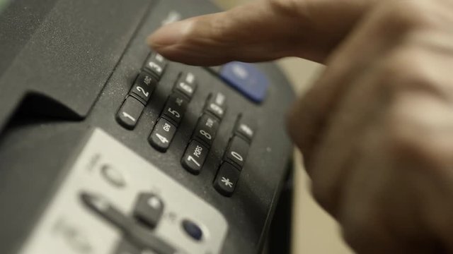 Elderly Man Dials The Numbers On MFP