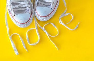 hope, message on shoelace with sneakers. - obrazy, fototapety, plakaty