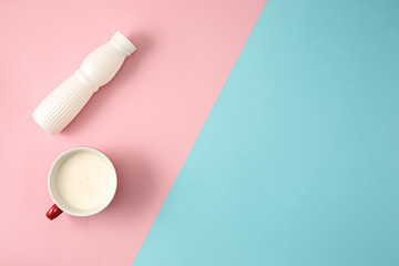 The bottle of yogurt and cup