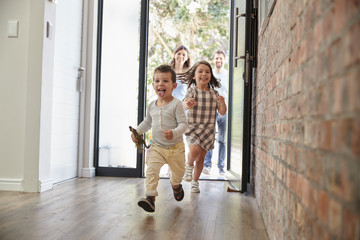 Excited Children Arriving Home With Parents - Powered by Adobe