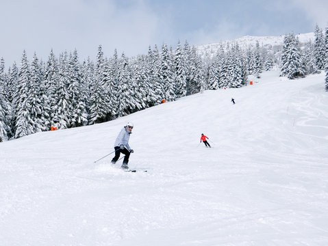 Skiers on the slope in ski resort Chopok in Slovakia. Tatra lower mountains.