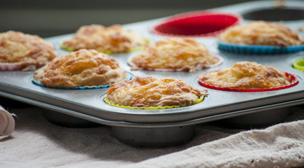 Savory cheese and bacon muffins on the wooden table