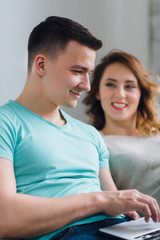 Young couple relaxing  in the morning with laptop computer