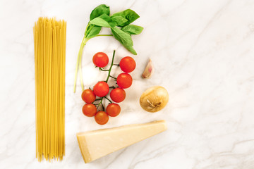 Basic pasta ingredients, including spaghetti and cheese