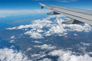 Fototapeta premium Wing aircraft on the sky above the Philippines earth and sky and clouds