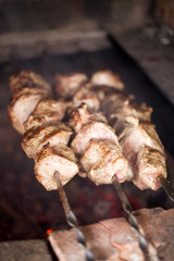 Pork meat grilled on skewers. Cooking shashlik