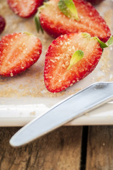 strawberries cut with sugar and mint