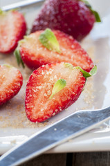 strawberries cut with sugar and mint