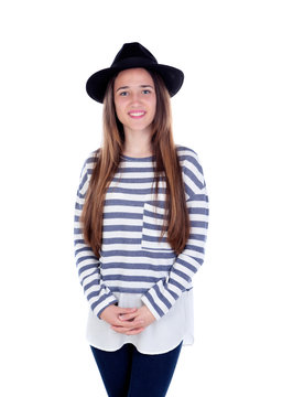 Pretty teenager girl with black hat posing at studio.