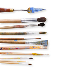 Drawing tools, set of dirty paint brushes in row
