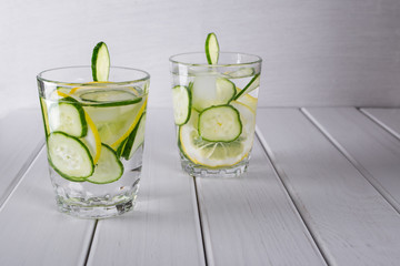 Refreshing  cucumber  cocktail, lemonade, detox water  in a glasses on a white background. Summer drink