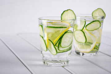 Refreshing  cucumber  cocktail, lemonade, detox water  in a glasses on a white background. Summer drink