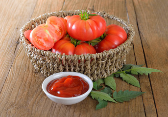 Fresh tomato sauce on wooden background