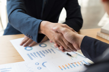 businessman handshaking after meeting in office - teamwork, cooperation, agreement, acquisition concept
