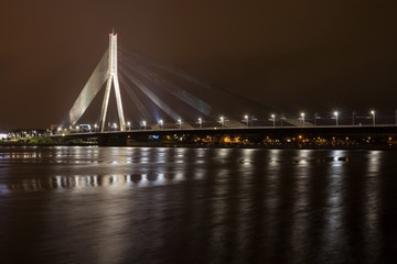 Fototapeta na wymiar Riga (Latvia) - April 17, 2017: Vansu Bridge (Formerly Gorky Bridge) at night. Shroud Bridge. Vansu Bridge is one of the symbols of modern Riga. Crossing the Daugava River