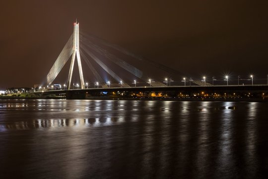 Riga (Latvia) - April 17, 2017: Vansu Bridge (Formerly Gorky Bridge) at night. Shroud Bridge. Vansu Bridge is one of the symbols of modern Riga. Crossing the Daugava River