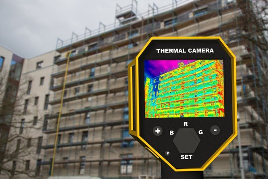  infrared thermal imager showing building facade and window heat loss