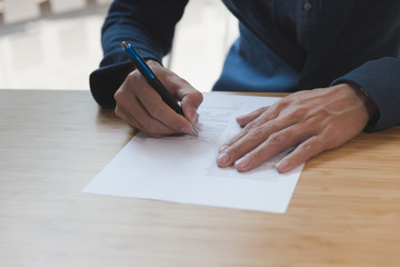 businessman signing contract document making a deal at office, business agreement, cooperation concept