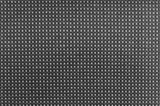 Grey nylon textile texture macro closeup, gray horizontal pattern detail, textured salt and pepper style black and white melange synthetic fabric, detailed background
