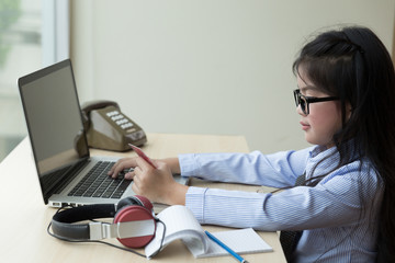 young asian girl holding credit card on laptop for internet online shopping