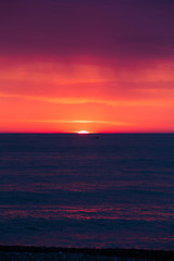 Natural Purple Color Sunset Or Sunrise Sky Over Sea After Storm 